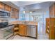 Kitchen featuring stainless steel appliances, tile floors and breakfast bar at 7117 Shadow Crest Dr, Las Vegas, NV 89119