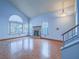 Bright living room with large arched window, fireplace and hardwood floors at 7117 Shadow Crest Dr, Las Vegas, NV 89119