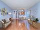 Open concept living room featuring hardwood floors and neutral paint, blending comfort and style at 7117 Shadow Crest Dr, Las Vegas, NV 89119