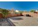 Paved backyard with a brick privacy wall, providing a serene outdoor space at 7433 Calzado Dr, Las Vegas, NV 89178