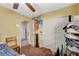 View of a bedroom with yellow walls, carpeted floor, closet and doorway at 7433 Calzado Dr, Las Vegas, NV 89178