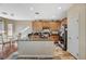 Spacious kitchen featuring an island, tile flooring, wooden cabinets and appliances at 7433 Calzado Dr, Las Vegas, NV 89178