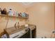 A laundry room featuring new machines and shelf storage at 7433 Calzado Dr, Las Vegas, NV 89178