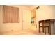 Bedroom showcasing a window with curtains, desk, chair and doorway into a well-lit spare room at 7950 W Flamingo Rd # 1139, Las Vegas, NV 89147