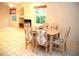 A bright dining room featuring a dining table with decorative chairs on a tile floor at 7950 W Flamingo Rd # 1139, Las Vegas, NV 89147