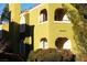 The two-story house features arched windows, stucco siding and a red tile roof with desert landscaping at 7950 W Flamingo Rd # 1139, Las Vegas, NV 89147