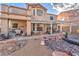 Inviting backyard featuring a pergola-covered patio, a built-in barbecue, and a decorative rock garden at 8404 Bay Crest Dr, Las Vegas, NV 89128