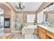 Bathroom featuring a walk-in shower and large tub, with neutral colors at 8404 Bay Crest Dr, Las Vegas, NV 89128