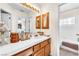 Bathroom with a view to the bedroom; features a shower, bath, and a large vanity area at 8404 Bay Crest Dr, Las Vegas, NV 89128