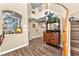 Elegant entryway featuring hardwood floors, decorative console table, and staircase at 8404 Bay Crest Dr, Las Vegas, NV 89128