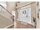 Bright foyer with hardwood floors, a staircase, and ample natural light at 8404 Bay Crest Dr, Las Vegas, NV 89128