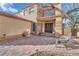 Inviting front patio area with brick pavers, plants, and a cozy seating area at 8404 Bay Crest Dr, Las Vegas, NV 89128