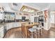 Well-equipped kitchen with a central island, granite countertops, and modern appliances under a decorative skylight at 8404 Bay Crest Dr, Las Vegas, NV 89128