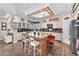 Bright kitchen featuring a granite island, white cabinetry, stainless steel appliances, and a decorative, lighted ceiling at 8404 Bay Crest Dr, Las Vegas, NV 89128