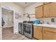 Well-organized laundry room equipped with modern washer and dryer, sink, and storage cabinets at 8404 Bay Crest Dr, Las Vegas, NV 89128