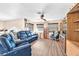 Bright living room with wood-look floors, a ceiling fan and comfortable furniture at 8404 Bay Crest Dr, Las Vegas, NV 89128