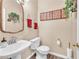 Charming powder room with decorative mirror, pedestal sink, and tasteful decor at 8404 Bay Crest Dr, Las Vegas, NV 89128