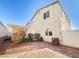 Private backyard featuring pavers, desert landscaping, and two air conditioning units at 8452 Viansa Loma Ave, Las Vegas, NV 89149