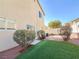 Private backyard featuring artificial grass and a patio area at 8452 Viansa Loma Ave, Las Vegas, NV 89149