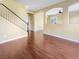 Open-concept living room featuring hardwood floors and archway detail at 8452 Viansa Loma Ave, Las Vegas, NV 89149