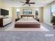 Spacious main bedroom with many windows, ample closet space, and a large bed at 8452 Viansa Loma Ave, Las Vegas, NV 89149