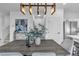 Dining room and stairs with gray walls and modern lighting at 10852 Avenzano St, Las Vegas, NV 89141