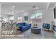 Bright living room featuring an open floor plan, modern fireplace, and contemporary furnishings at 10852 Avenzano St, Las Vegas, NV 89141