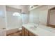 All-white bathroom with white-tile countertops and shower-tub combination at 1612 Olive Palm Cir, Las Vegas, NV 89128