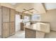 Kitchen featuring built-in appliances, laminate countertops and natural wood cabinets at 1716 Battle Creek Cir, Las Vegas, NV 89108