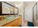 Bathroom vanity featuring granite countertop and a vessel sink with a glass door shower at 1971 S Manzanita Dr, Pahrump, NV 89048