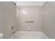 A bathtub with a showerhead and safety bar at 228 N Bruce St # D, Las Vegas, NV 89101