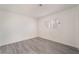 An empty bedroom with a window and wood flooring at 228 N Bruce St # D, Las Vegas, NV 89101