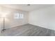 A bedroom with a window and wood flooring at 228 N Bruce St # D, Las Vegas, NV 89101