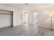 A bedroom with a closet, lamp, and wood flooring at 228 N Bruce St # D, Las Vegas, NV 89101