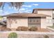 Exterior view of a single story home with mature bushes at 228 N Bruce St # D, Las Vegas, NV 89101