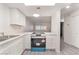 Renovated kitchen with white cabinets, new appliances, and spacious countertops at 228 N Bruce St # D, Las Vegas, NV 89101