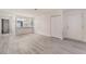 Spacious living area with kitchen access, and new floors at 228 N Bruce St # D, Las Vegas, NV 89101