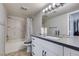 Updated bathroom with granite vanity, bright lighting, and a shower-tub combination at 2300 E Silverado Ranch Blvd # 2162, Las Vegas, NV 89183
