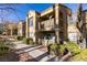 Charming condo complex with well-maintained landscaping, private balconies, and convenient access to walkways at 2300 E Silverado Ranch Blvd # 2162, Las Vegas, NV 89183