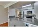 Modern kitchen with granite countertops, stainless steel appliances, and stylish white cabinets at 2300 E Silverado Ranch Blvd # 2162, Las Vegas, NV 89183