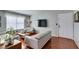 Bright living room with hardwood floors, modern furniture, and a large window with natural light at 2300 E Silverado Ranch Blvd # 2162, Las Vegas, NV 89183