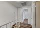 Hallway featuring wood-look floors, access to a closet, and white doors at 2333 Wooster Cir # B, Las Vegas, NV 89108