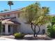Charming two-story home with mature tree, terracotta roof and solar panels at 2451 Muirfield Ave, Henderson, NV 89074