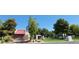 Scenic community park with lush greenery, play structures, and inviting picnic areas at 2451 Muirfield Ave, Henderson, NV 89074