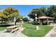 Community park featuring a shaded picnic area, basketball court, and well-maintained grassy fields at 2451 Muirfield Ave, Henderson, NV 89074