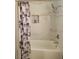Shower showcasing modern tile, a rainfall shower head, and built-in shelving at 2451 Muirfield Ave, Henderson, NV 89074