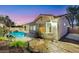 Landscaped backyard featuring a pool and stone walkway at 2725 Cool Lilac Ave, Henderson, NV 89052