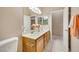 Bathroom featuring double sinks, tile flooring, and a separate toilet area at 2725 Cool Lilac Ave, Henderson, NV 89052