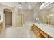 Large bathroom with a jacuzzi tub, walk-in shower, and vanity with a make up counter at 2725 Cool Lilac Ave, Henderson, NV 89052