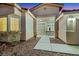 Inviting front entrance features a walkway, desert landscaping, and cozy seating area at 2725 Cool Lilac Ave, Henderson, NV 89052